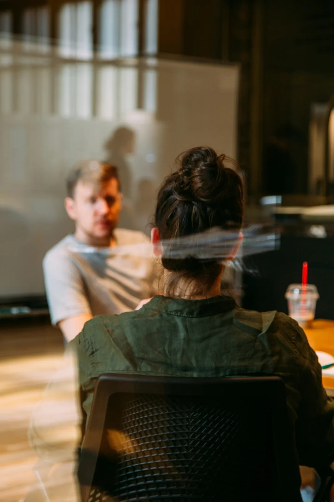 Two professionals in a focused consulting conversation