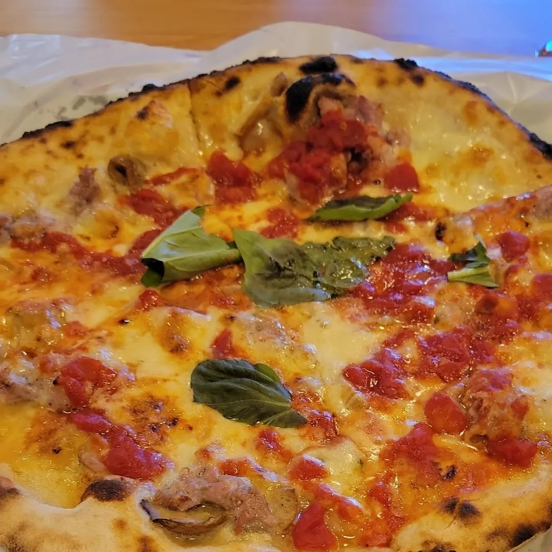 A wood-fired Neapolitan pizza fresh from the oven